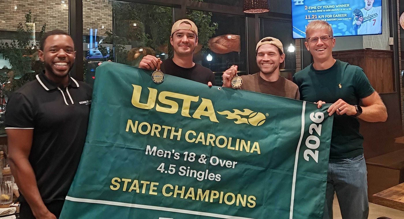 Thibault and three teammates holding the USTA North Carolina 2026 Men's 18 and Over 4.5 Singles State Champions banner, two of them with medals